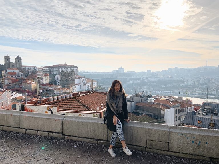 Anna sitting in front of city skyline