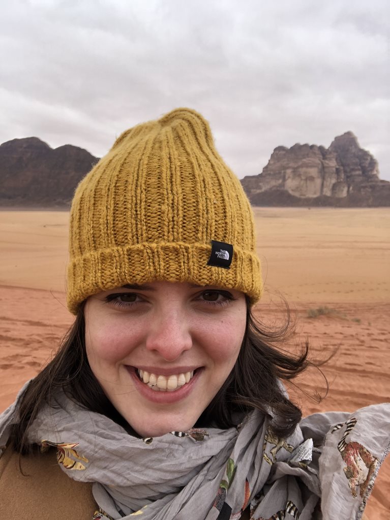 Donatela wearing yellow hat in desert