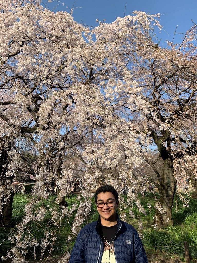 Meghna in front of cherry blossoms