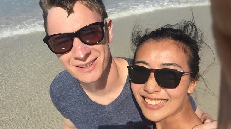 Mina on beach with husband