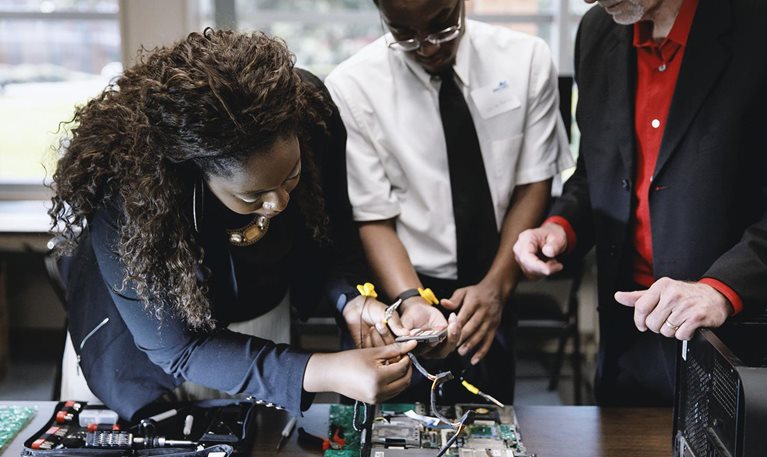 IT support is just one of several areas in which Generation prepares, guides, and supports people for life-changing careers. (Photo of a Generation USA participant in 2019.)