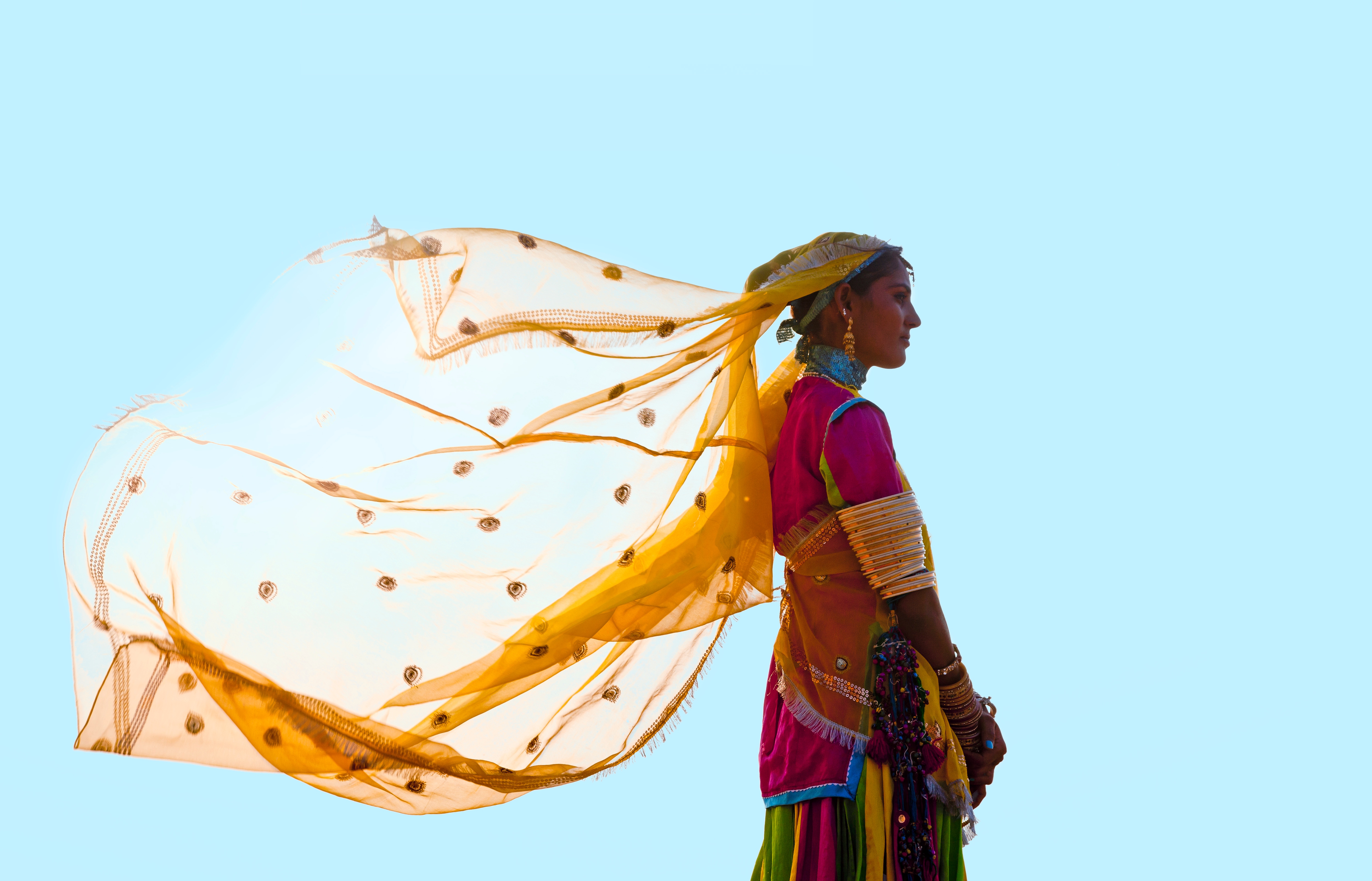 Photo of a person with clothes blowing in the wind