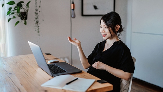 Image of a women working at a desk at home