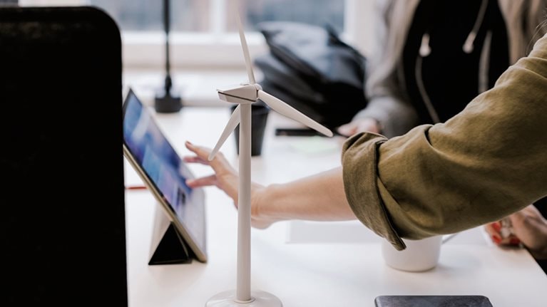 Image of a person touching a tablet