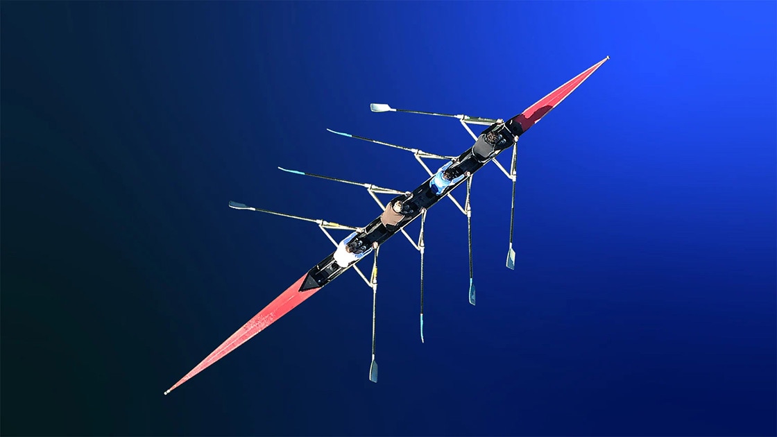 Overhead image of rowers in a longboat