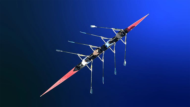 Overhead image of rowers in a longboat