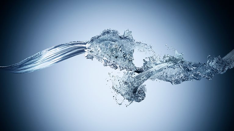 Image of two water streams colliding in midair