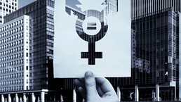 An icon for inclusivity across sexual orientations overlaid on city buildings