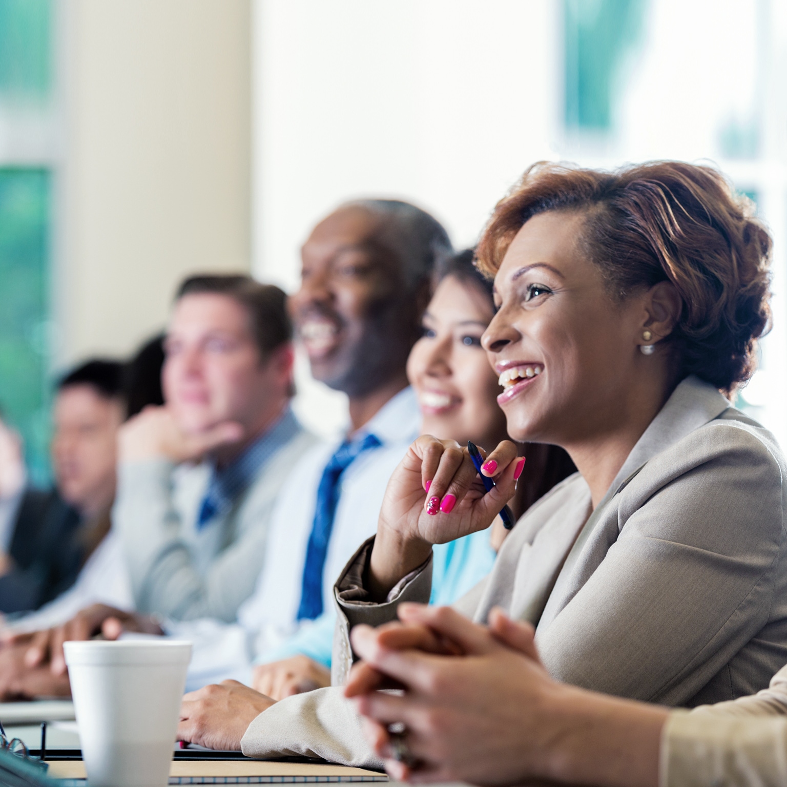 Black businesswoman attending seminar or job training business conference