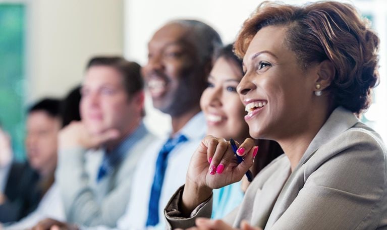 Black businesswoman attending seminar or job training business conference