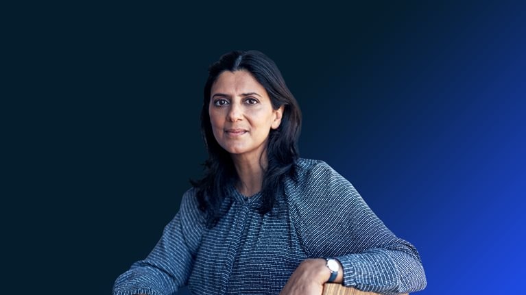 Portrait of a mature businesswoman having a meeting with her team in a modern office