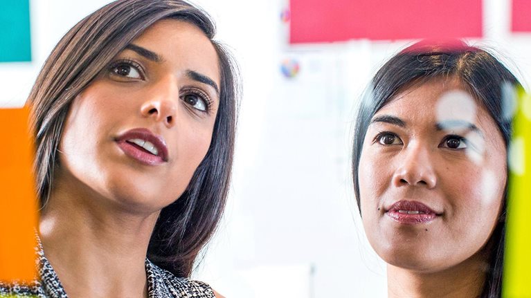 Two women collaborating