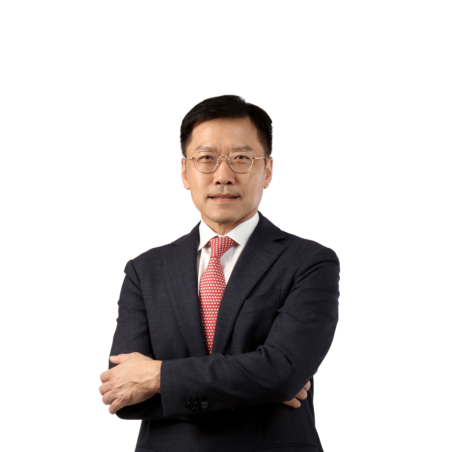 Photograph of Lee Yuan Siong in a dark suit and red tie against a white background