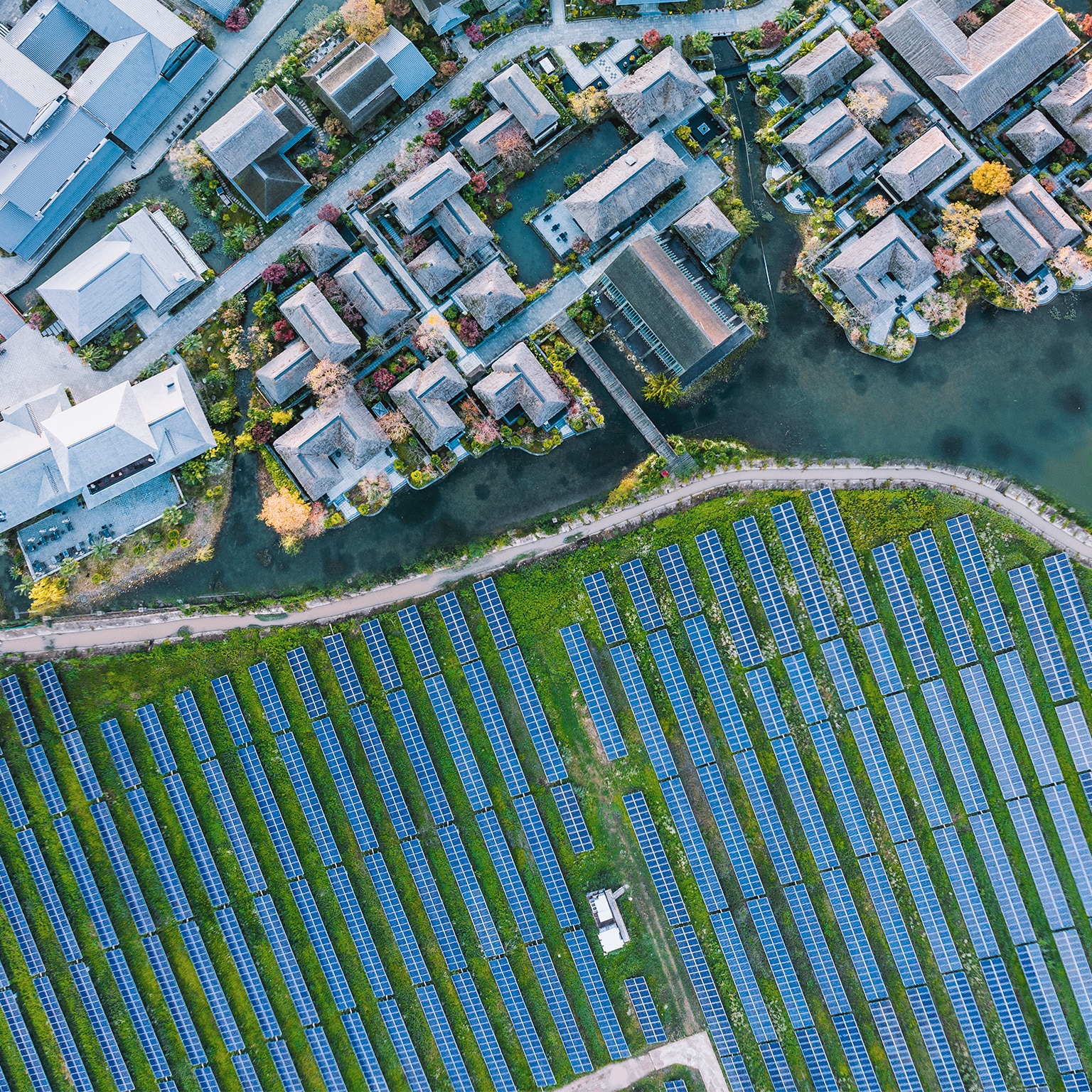Solar power station with modern city buildings - stock photo