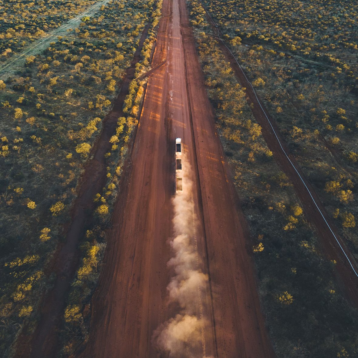 Aerial image showing a road train driving on the Tanami Road, Northern Territory, Australia