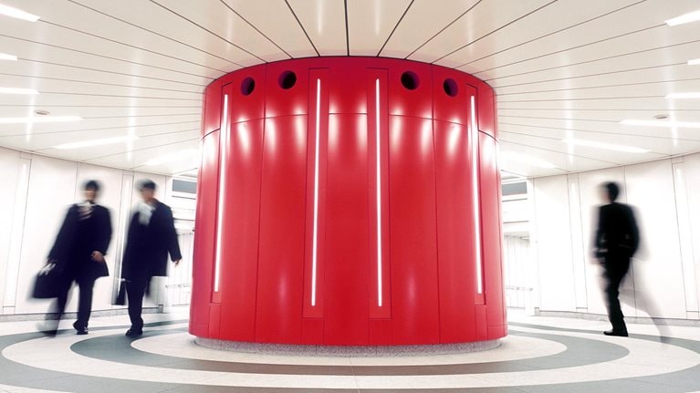Businessmen crossing an underground underpass at a business district in Tokyo, Japan. - stock photo