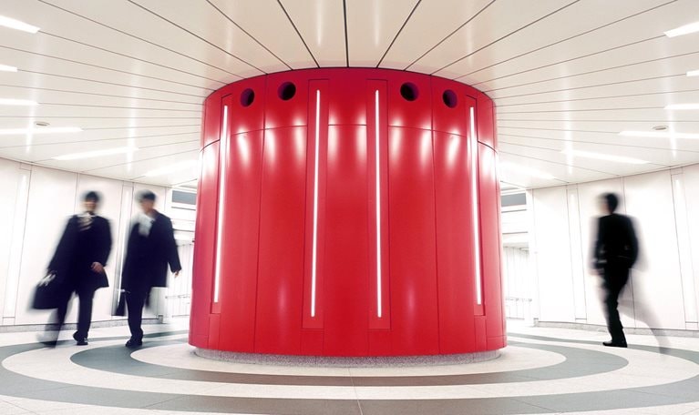 Businessmen crossing an underground underpass at a business district in Tokyo, Japan. - stock photo