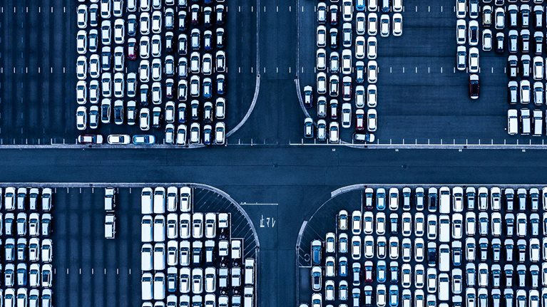 overhead view of cars in airport parking lot - stock photo