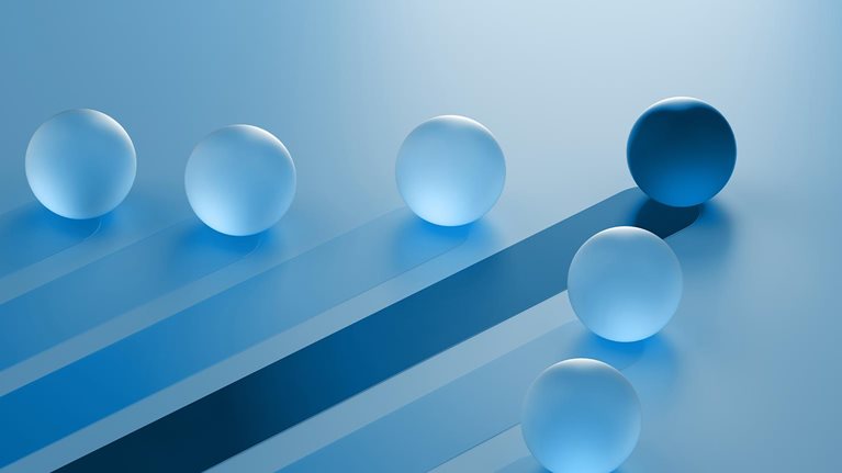 The image is an abstract 3D render showing translucent blue spheres on a light blue surface, with one darker blue sphere standing out. Winning Strategy, Efficiency, Innovation, Success in Business Concept, Teamwork and Leadership.