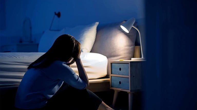 crying asian woman feel depressed in the bedroom at home - stock photo