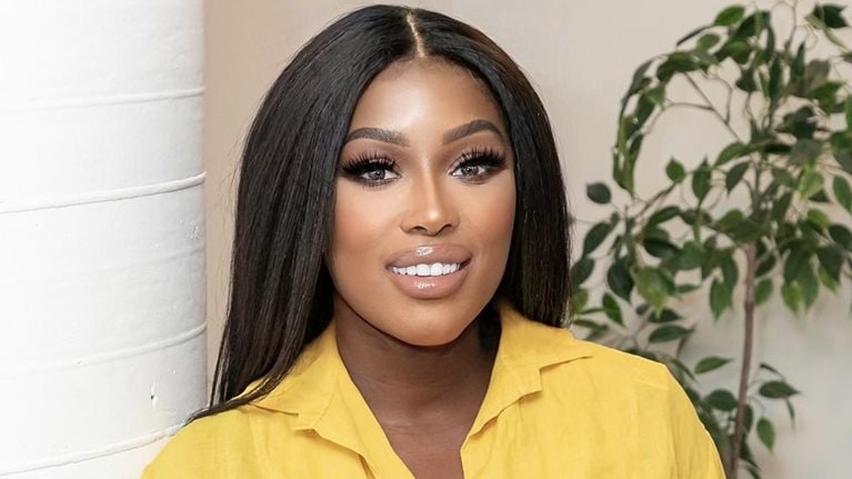 Portrait of the author, Netta Jenkins in a yellow collared shirt.
