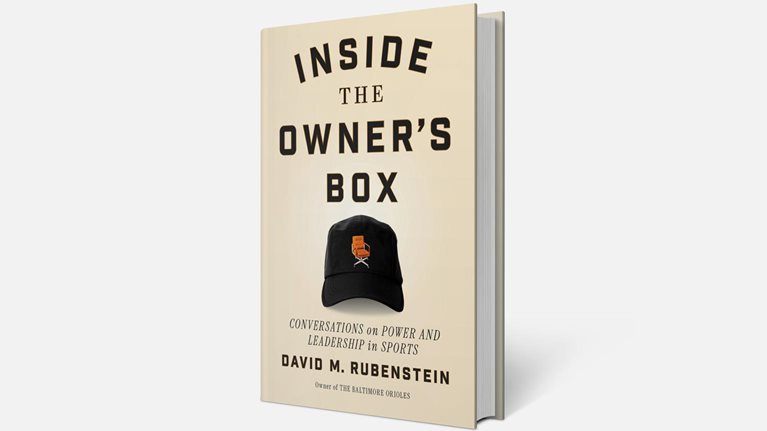 3D rendering of a beige book on a light gray background with the cover text “Inside the Owner’s Box,” “Conversations on Power and Leadership in Sports,” and “David M. Rubenstein.” The cover includes an image of a black baseball cap with a small orange chair graphic.
