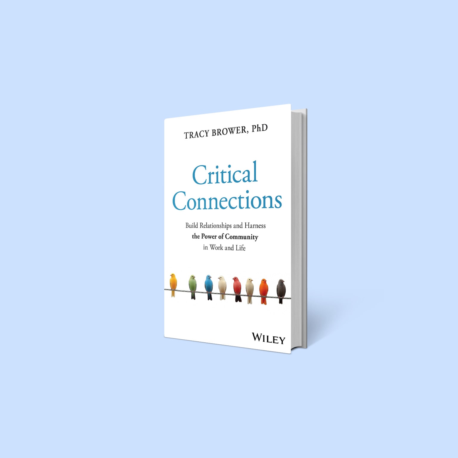 A book titled Critical Connections by Tracy Brower, PhD, displayed against a light blue background. The cover features a row of colorful birds perched on a wire.