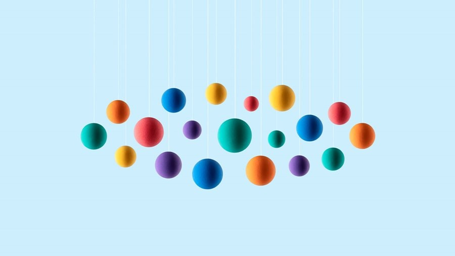 Rainbow colored spheres hanging on strings