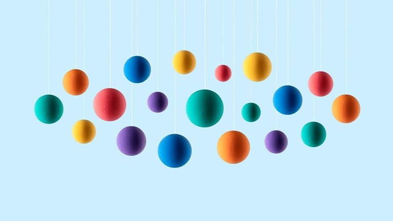 Rainbow colored spheres hanging on strings