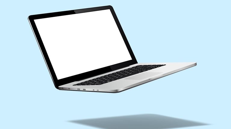 Levitating laptop on a blue background