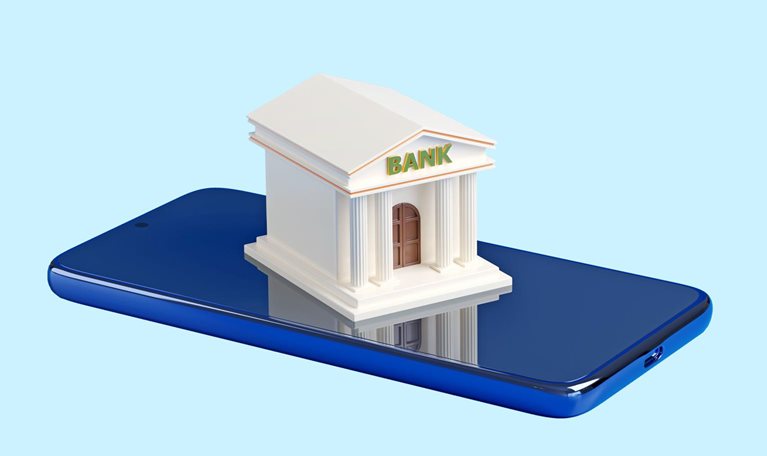 A stylized miniature bank building with the word "BANK" on its facade sits on top of a blue smartphone.