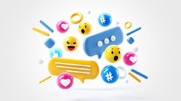 A energetic and tightly grouped collection of social media reaction icons including hearts, thumbs up, happy and surprised faces along with comment and texting bubbles and hashtags. 