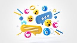 A energetic and tightly grouped collection of social media reaction icons including hearts, thumbs up, happy and surprised faces along with comment and texting bubbles and hashtags.