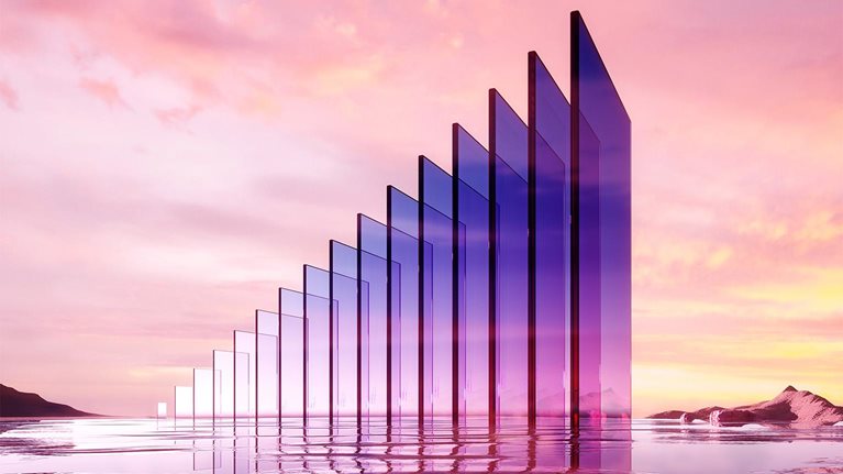 Digital generated image of abstract growing bar graph made out of glass standing on reflective surface.