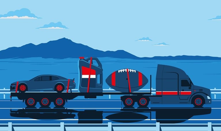 A semi-truck is shown driving on a highway with symbols on its flatbed that represent the life and legacy of Lucas oil founder, Forrest Lucas. A car, a bottle of synthetic oil, and a large American football are set against a scenic backdrop of mountains and a blue sky with clouds.