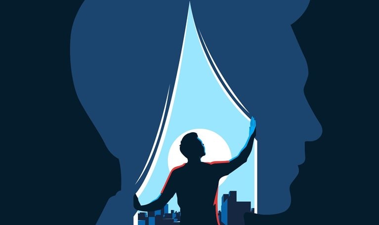In the illustration, a person is looking through a window at a cityscape. The window is in the shape of a human head, which represents the mind.
