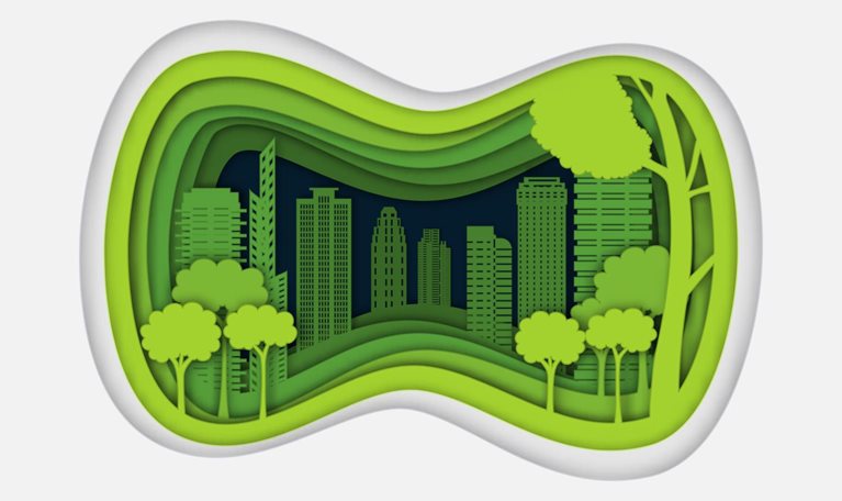 Paper cut image of a city with trees and tall buildings inside it.