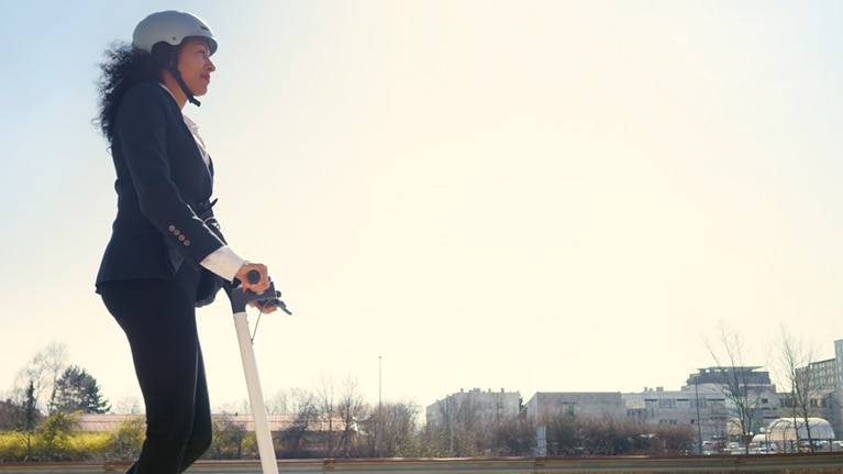 Image of woman on electric scooter