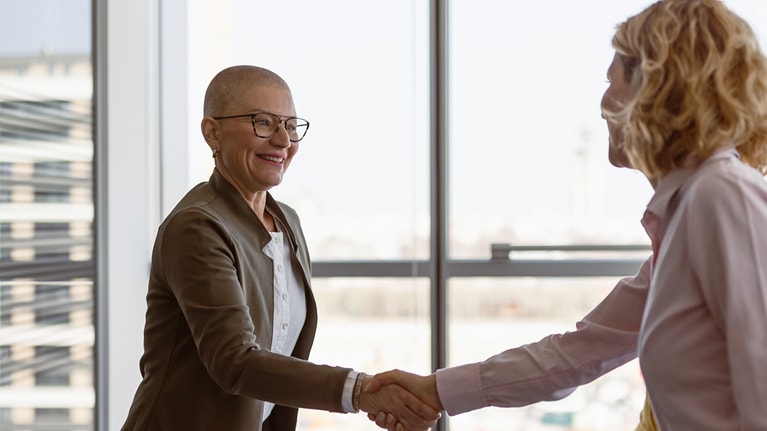 Image of two business women shaking hands