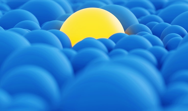 Yellow orb in a sea of blue orbs