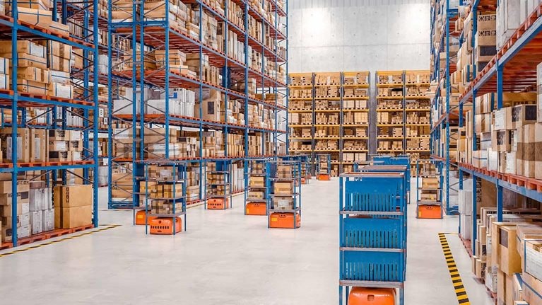 Interior of a modern warehouse where automated goods transport vehicles work. - stock photo