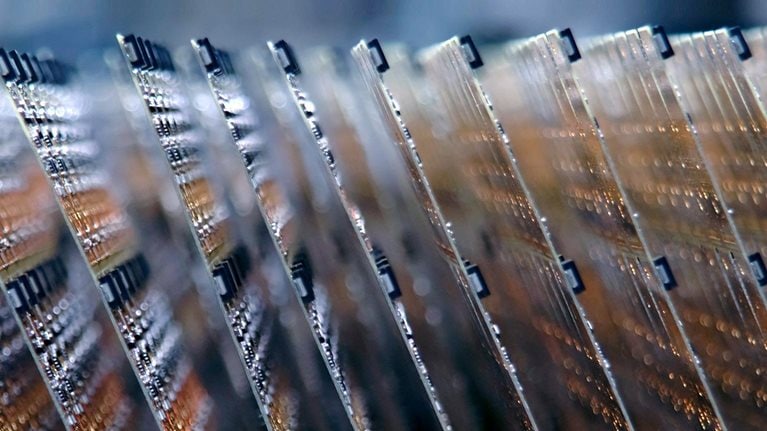 Electronic circuit boards stacked on an assembly line
