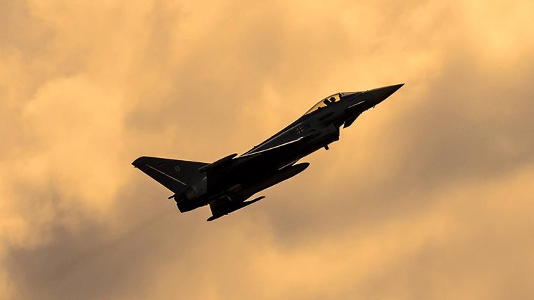 Fighter aircraft in the sky at sunset (Eurofighter)