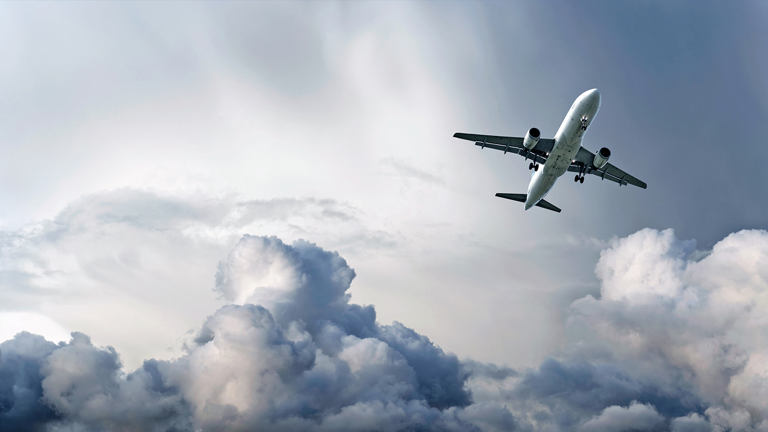 Commercial airliner flying through clouds