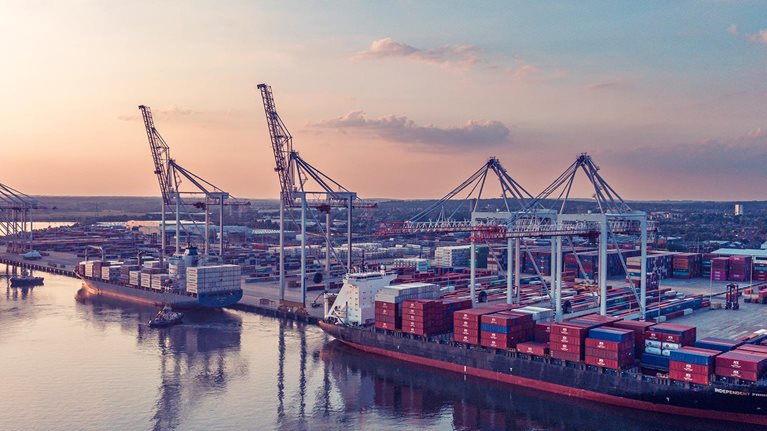 An aerial view of container ships in dock