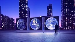 Illuminated cityscape with man looking at Earth expo