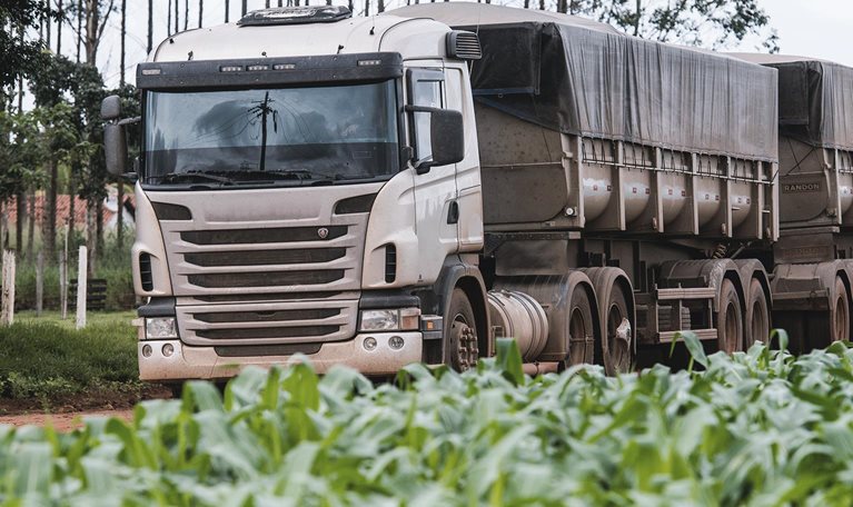 Truck next to a soy plantation