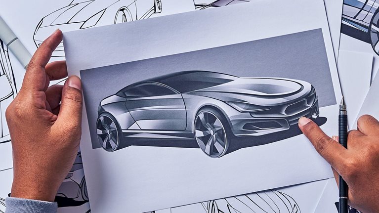 Industrial designer drawing a sketch for a concept car prototype.
