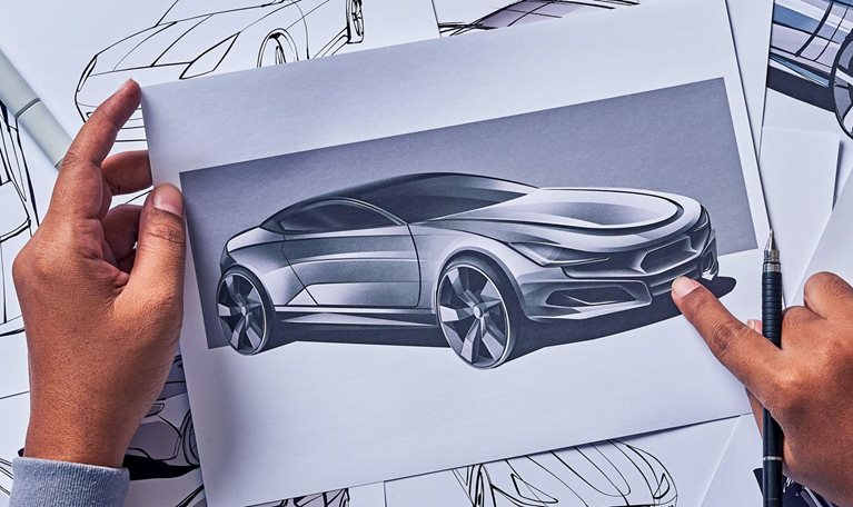 Industrial designer drawing a sketch for a concept car prototype.