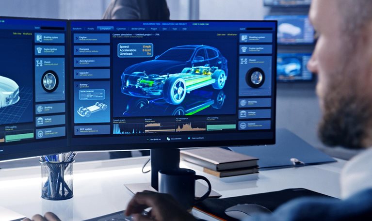 Engineers check aerodynamics of electric car on computer screen - stock photo